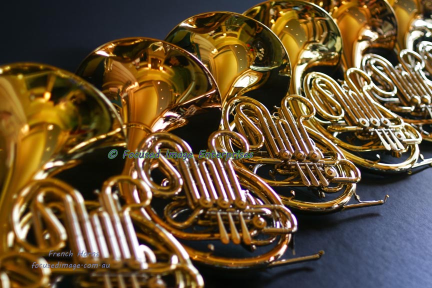 Shiny French Horns in a row.